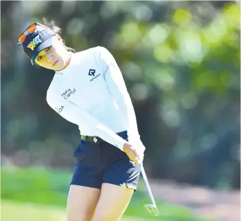  ?? - AFP photo ?? Lydia Ko of New Zealand hits onto the 9th green during round two of the Gainbridge LPGA at Lake Nona Golf and Country Club in Orlando, Florida.