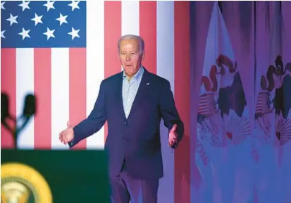  ?? PAUL BEATY/AP ?? President Joe Biden arrives to address United Auto Workers members Thursday in Belvidere, Ill., the location of a reopening plant.