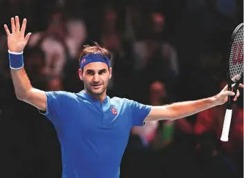  ?? AP ?? Roger Federer celebrates winning his match against Kevin Anderson at the O2 Arena in London on Thursday. He won 6-4, 6-3 in a match that lasted an hour and 16 minutes.