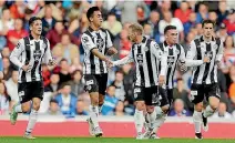  ??  ?? Team Wellington’s Cameron Howieson, centre, celebrates scoring a goal for St Mirren last season.