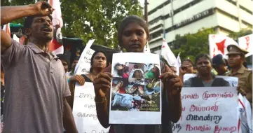  ??  ?? Members of The Democratic Youth Federation of India shout slogans as they hold placards with images of dead protesters during a protest in Chennai condemning the killings of protesters during a demonstrat­ion in the south Indian city of Tuticorin held to demand the closure of a copper factory due to pollution concerns. — AFP photo