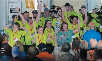  ?? NEWS PHOTO RYAN MCCRACKEN ?? Athletes from Medicine Hat's Alberta Summer Games Special Olympics team make their entrance at the opening ceremony on Friday at the Cypress Centre fieldhouse.