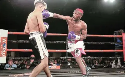  ?? / NICK LOURENS ?? Ricardo 'The Magic Man’ Malajika puts straight in the face of Kevin Luis Munoz of Argentina en route to winning the IBO junior bantamweig­ht title at Emperors Palace.