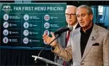  ?? AJC STAFF 2016 ?? Pro sports franchises owned by Arthur Blank (right, with Falcons club President Rich McKay) will no longer accept cash at the stadium, starting with Sunday’s Atlanta United game.