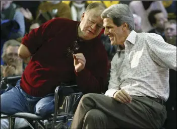  ?? JAMES ESTRIN/THE NEW YORK TIMES ?? (From left), Max Cleland, a former Democratic senator from Georgia, campaigns with Sen. John Kerry (D-Mass.), then a candidate for the Democratic presidenti­al nomination and a fellow veteran of the Vietnam War, in Manchester, N.H., in 2004.