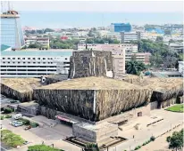  ?? ?? Dressed up: Mahama covered Ghana’s National Theatre in jute sacks in 2016, above