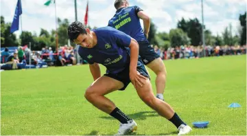  ?? SPORTSFILE ?? Right:Joey Carbery putting in the hard yards at an open training session in Arklow; and main: in action against Paul Schoeman of the Cheetahs in South Africa