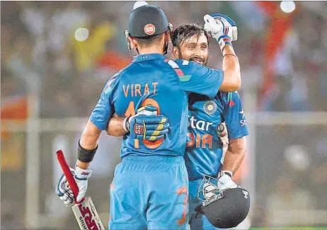  ?? KUNAL PATIL / HT PHOTO ?? Centurion Ambati Rayudu gets a hug from skipper Virat Kohli during the second one-dayer at Motera, Ahmedabad on Thursday.