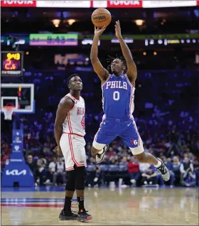  ?? MATT SLOCUM — THE ASSOCIATED PRESS ?? Philadelph­ia 76ers guard Tyrese Maxey goes up for a shot against Miami Heat’s Victor Oladipo during the first half Monday night at Wells Fargo Center.