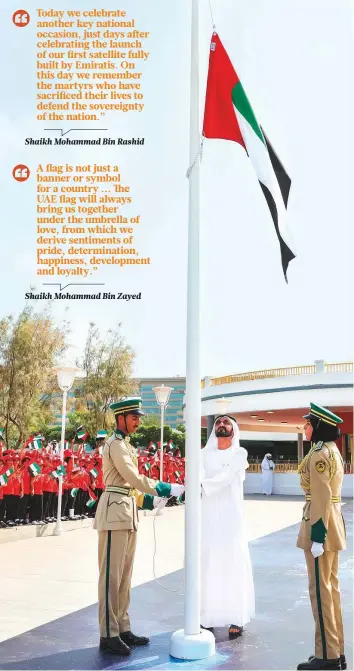  ??  ?? Shaikh Mohammad Bin Rashid raises the UAE Flag at Union House yesterday as 1,600 students and UAE officials look on. Shaikh Hamdan Bin Mohammad was also present. WAM