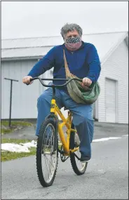  ?? (The Tribune-Democrat/Todd Berkey) ?? Johnstown Tribune-Democrat newspaper carrier Bill Berkey uses a bike to deliver his papers around Jennerstow­n, Pa. He has been delivering papers for the past 50 years.