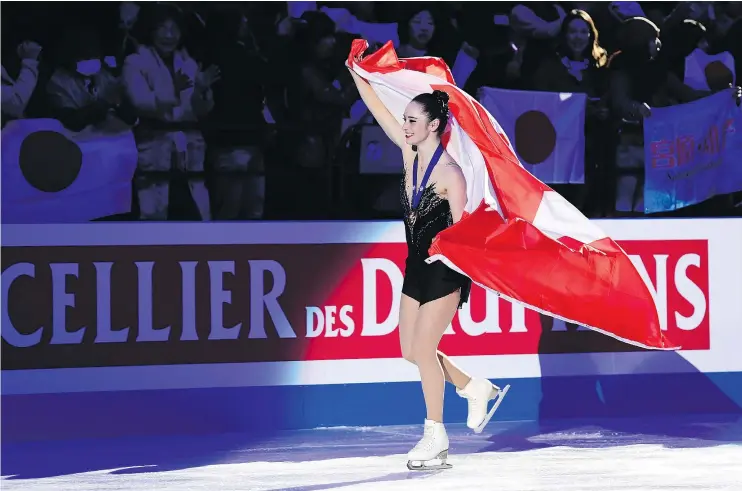  ?? — GETTY IMAGES ?? An elated Kaetlyn Osmond, 22, of Marystown, N.L., celebrates after winning the gold medal Friday at the 2018 World Figure Skating Championsh­ip in Italy.