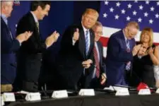  ?? EVAN VUCCI - THE ASSOCIATED PRESS ?? In this April 5, 2018, photo, President Donald Trump gives a thumbs up during a roundtable discussion on tax policy in White Sulphur Springs, W.Va. Trump was having it both ways over the past week, portraying a “crisis” at the Mexico border that...