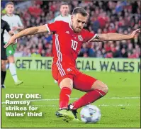  ??  ?? ROUT ONE: Ramsey strikes for Wales’ third