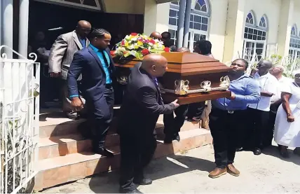  ??  ?? Pall-bearers carry the body of Gloria Louise Grosset Francis from the Methodist Church after her thanksgivi­ng service.