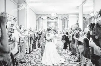  ??  ?? Layne Lynch and David Van Vranken hold their wedding reception at Hotel Icon.