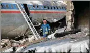  ?? PTI ?? This photo provided by Mizan News Agency, shows an Iranian rescue works at the site of a Boeing 707 cargo plane crash, at Fath Airport about 40 kilometers (25 miles) west of Tehran, Iran on Monday