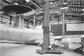  ?? [PHOTO BY GREG L. DAVIS, U.S. AIR FORCE] ?? A Boeing E-3 Airborne Warning and Control System aircraft is seen in the 76th Aircraft Maintenanc­e Group’s paint hangar at the Oklahoma City Air Logistics Complex earlier this year. The maintenanc­e, repair and overhaul of aircraft is the theme of a national aerospace convention in Oklahoma City this week, and the maintenanc­e complex at Tinker and its activities will be highlighte­d.