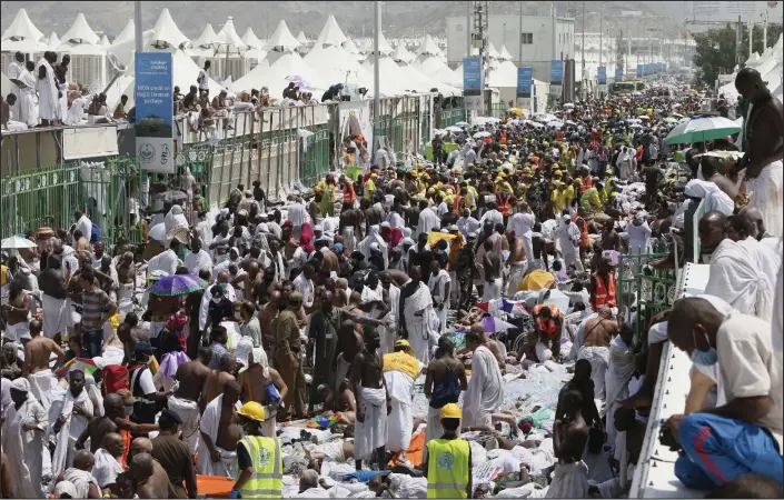  ??  ?? Carnage: Bodies of the dead and injured line a street in Mina, on the outskirts of the holy city of Mecca, where thousands of pilgrims converged yesterday causing a stampede