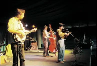  ?? ?? LEFT: Billy and the Hillbillie­s performing at the Big Puyallup Fair in 2013. Shown are Ellery Marshall (from left), John Marshall and Evan Marshall.