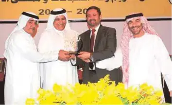  ?? Gulf News/ Archives ?? Mirza Al Sayegh (second from left) and Shareef Al Halawani (second from right) have worked together to ensure that Jebel Ali Racecourse ticks all the right boxes every season, with the support of Abdullah Al Ansari (right) and Masoud Saleh (left).