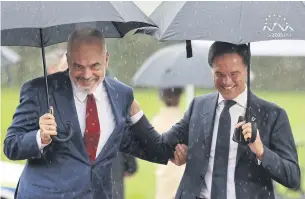  ?? AFP ?? Albania’s Prime Minister Edi Rama, left, and Netherland­s’ Prime Minister Mark Rutte arrive for the EU-Western Balkans summit at Brdo Congress Centre, near Ljubljana yesterday.