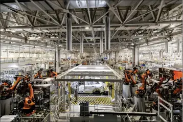  ?? QILAI SHEN — THE NEW YORK TIMES ?? Robotics are a major part of the workplace at a car factory in Hefei, China, and elsewhere around the country. Today, manufactur­ing accounts for a smaller share of the world's output and China already does more than a third of it.