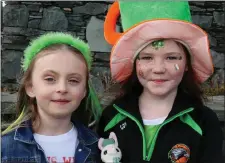  ??  ?? Erin Milligan and Grace O’Keeffe taking part in the St Patrick’s Day parade in Rathmore held on Sunday in keeping with the town’s recent trend of holding the parade days before the big day.