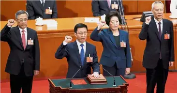  ?? — Reuters ?? Ready to serve: Newly elected vice-premiers (from left) Hu Chunhua, Han Zheng, Sun Chunlan and Liu taking their oath at the Great Hall of the People in Beijing.