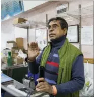  ?? THE ASSOCIATED PRESS ?? Bangladesh­i immigrant Sultan Ahmed gestures as he speaks during an interview with The Associated Press on Tuesday in the Kensington neighborho­od in Brooklyn.