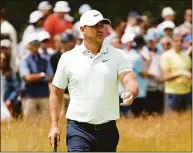  ?? Jared C. Tilton / Getty Images ?? Brooks Koepka waves on the second green during the third round of the 122nd U.S. Open Championsh­ip at The Country Club on Saturday in Brookline, Mass. Koepka, who will join the LIV Golf tour, withdrew from the Travelers Championsh­ip.