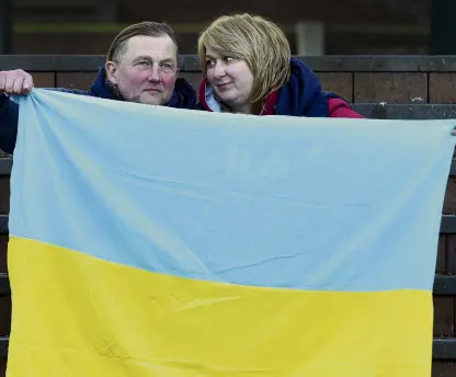  ?? PHOTO: PETER MCINTOSH ?? Solidarity . . . Showing their support for Ukraine yesterday are Oleksii Ikonnikov and Olha Viazenko who have been organising weekly protests in the Octagon.