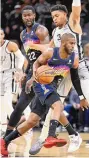  ?? DARREN ABATE/ASSOCIATED PRESS ?? Phoenix’s Chris Paul drives against San Antonio’s Keldon Johnson during Monday night’s game in San Antonio.