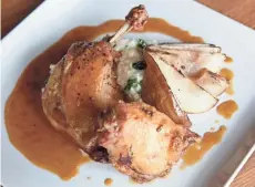  ?? MIKE DE SISTI / MILWAUKEE JOURNAL SENTINEL ?? Homey dishes with a chef’s touch such as chicken and duck thighs with risotto and pear are served at Tofte’s Table in Waukesha.