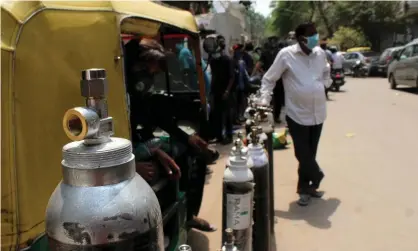  ?? ?? People stand in a queue with their oxygen cylinders outside a shop to get them refilled in Delhi, India. Photograph: Mayank Makhija/ NurPhoto/REX/Shuttersto­ck