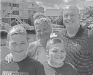  ?? WATKINS FAMILY PHOTO ?? Richard Watkins, right, had a heart attack, not from plaque building up in his arteries, but from stress. Watkins is shown with his wife, Nichol, and sons, Chase, left, and Zack.