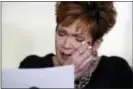  ?? ASSOCIATED PRESS ?? Beverly Young Nelson, the latest accuser of Alabama Republican Roy Moore, reads her statement at a news conference, in New York, Monday. Nelson says Moore assaulted her when she was 16 and he offered her a ride home from a restaurant where she worked....