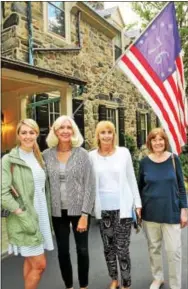  ??  ?? Katie Ingelsby of Wayne, Diane Lucki of Phoenixvil­le, Melissa Cichowicz of King of Prussia and Jennie Skerl of Paoli are “flagged” down for a photo op before entering an 85-year-old homestead.