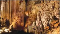  ?? FILE PHOTO ?? U.S. Forest Service tour guide Arnold Hearn, bottom left, is shown in the Cathedral Room on the upper level of the Dripstone Trail at Blanchard Springs Caverns in the Ozark National Forest near Mountain View. The half-mile trail travels through two...