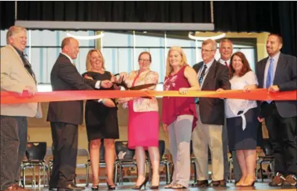  ?? PHOTO COURTESY OF UPPER MERION AREA SCHOOL DISTRICT ?? From left, Upper Merion Area School Board member Dr. Gary Ledebur, Caley Road School Principal Steven Van Mater, School Board President Alice Budno Hope, board member Maggie Philips, board member Maura Buri, Upper Merion Director of Operations Fred Remelius, Superinten­dent Dr. John Toleno, board member Robyn Briggs and board member Eric Elvanian cut the ribbon at the new Caley Road Elementary School, Wednesday, Aug. 29.