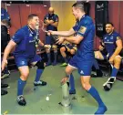  ??  ?? Leading the spray: Tadhg Furlong and Johnny Sexton celebrate the Pro14 win