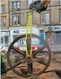  ?? CITY OF EDINBURGH COUNCIL ?? Rescued for restoratio­n, one of the pulley wheels is lifted out of its pit for restoratio­n. City of Edinburgh Council is now considerin­g where best to display the wheels alongside the new tram line down Leith Walk.