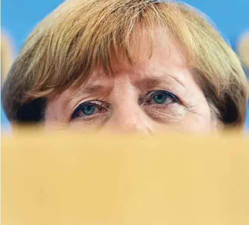  ?? Foto: AFP/John Macdougall ?? Bundeskanz­lerin Angela Merkel hat Linksextre­misten und unerwünsch­te Flüchtling­e im Fokus.