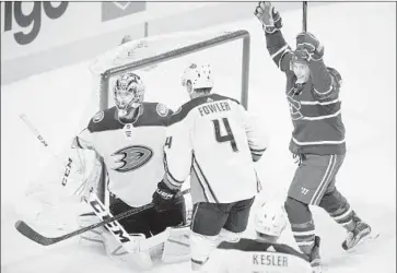  ?? Graham Hughes Associated Press ?? MONTREAL’S Brendan Gallagher celebrates Jeff Petry’s goal as Reto Berra and Cam Fowler of Ducks react.