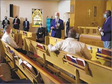  ?? Carolyn Kaster Associated Press ?? DEMOCRATIC nominee Joe Biden meets with community members at Grace Lutheran Church in Kenosha, Wis., on Thursday. Earlier he spoke by phone with Jacob Blake, whose shooting by police triggered protests.