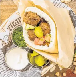  ?? HUMMUS HOUSE ?? For National Sandwich Month, the Hummus House in Fort Lauderdale has an offer on Falafel Pita Sandwiches where you buy one and get the second sandwich for 50% off.