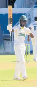  ?? BY LENNOX ALDRED PHOTO ?? Jamaica Scorpions wicket-keeper batsman Romaine Morris acknowledg­es the applause after scoring a half-century against the Barbados Pride on day one of their West Indies Championsh­ip match at Sabina Park yesterday.
