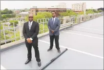  ?? Jordan Grice / Hearst Connecticu­t Media ?? Darren Mondezie, left, and Johnathan Neverson, founders of Stratford-based Liberty Parking LLC, with a Parker Marker in downtown Bridgeport.