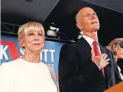  ?? [AP PHOTO] ?? In this Nov. 7 photo, Republican Senate candidate Rick Scott speaks with his wife Ann by his side at an election watch party in Naples, Fla.