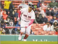  ?? Steven Senne / Associated Press ?? Michael Chavis of the Red Sox runs toward first after hitting an RBI single against the Mariners Sunday.